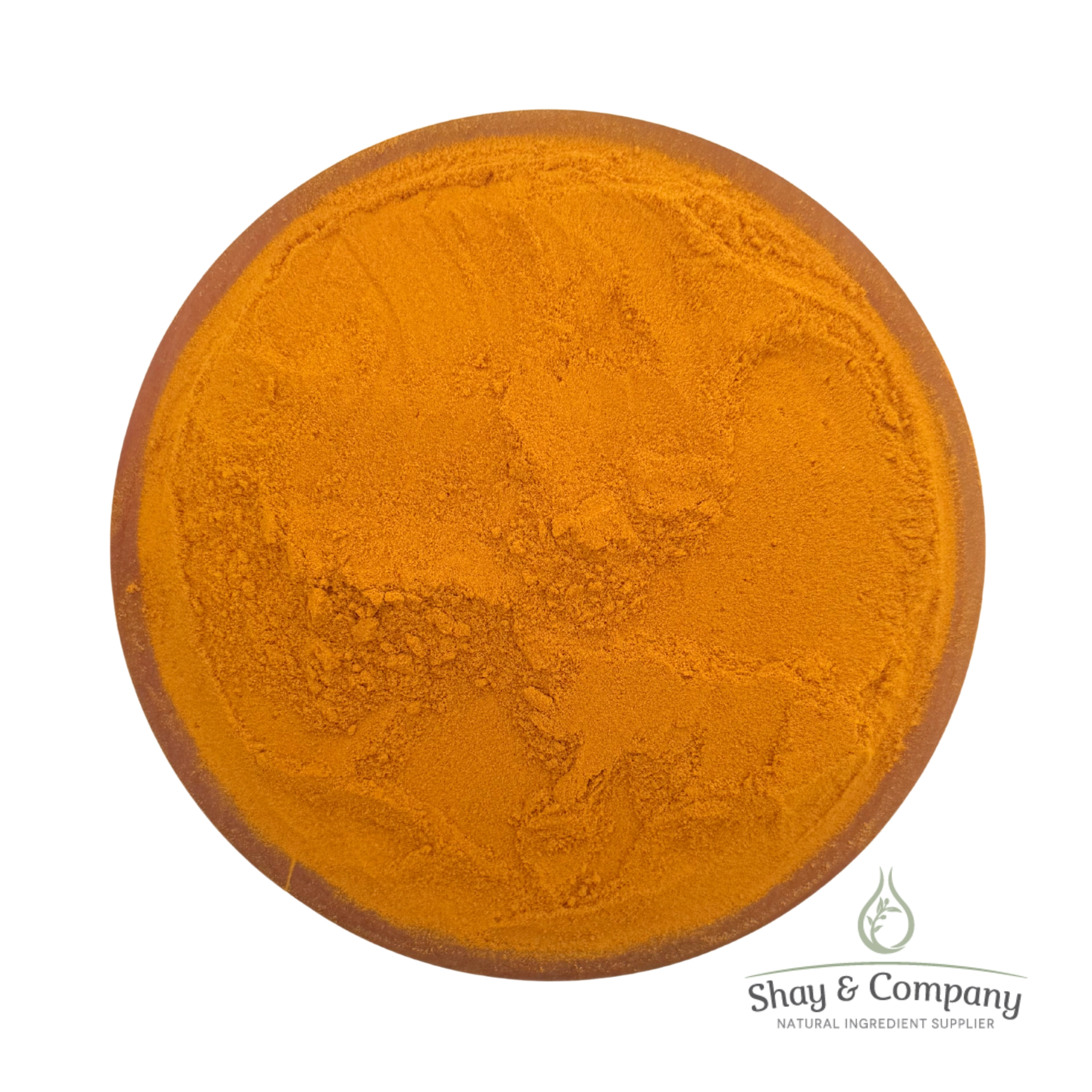 Turmeric powder in a clay bowl from Shay & Company natural ingredient supplier.
