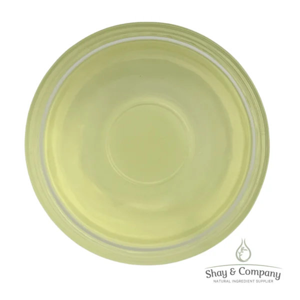Pale yellow-green circular cosmetic or skincare product in a clear container with Shay & Company branding.