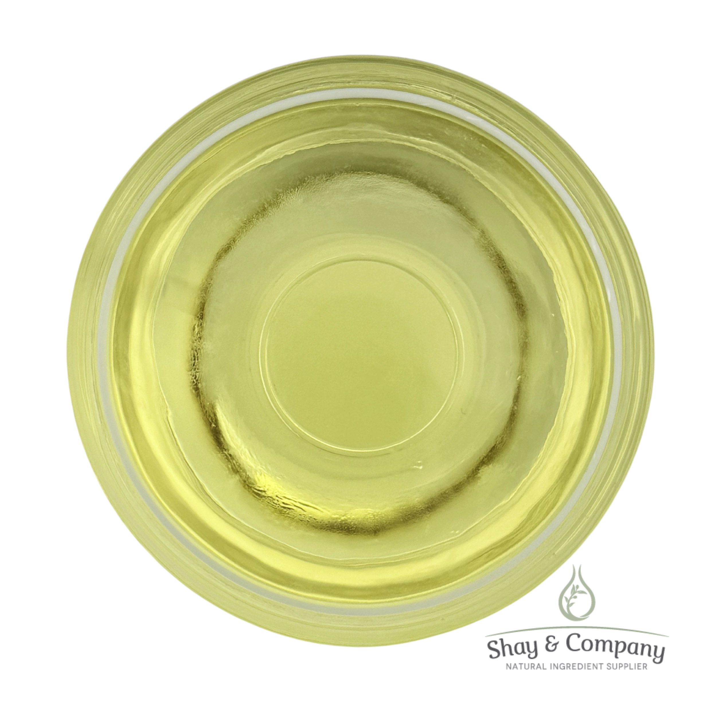 Top-down view of pale yellow natural oil in a clear glass dish from Shay & Company ingredient supplier.