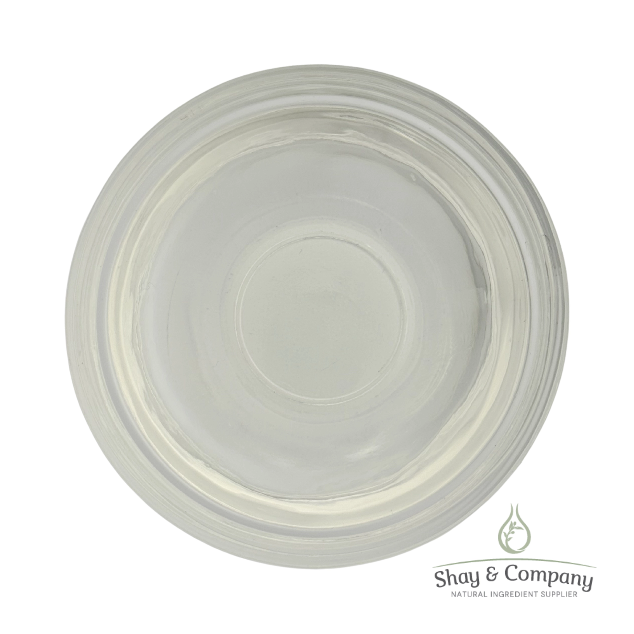 Clear glass bowl with concentric circular ridges viewed from above on white background.